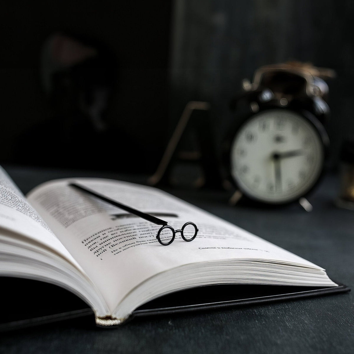 Round Glasses metal bookmark on a coloured background