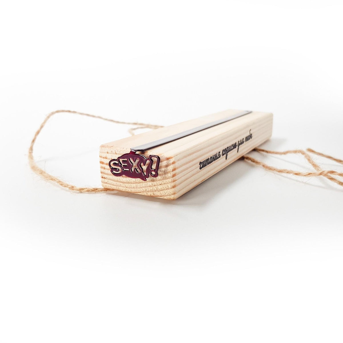 Sexy Smart metal bookmark shown with its wooden gift block