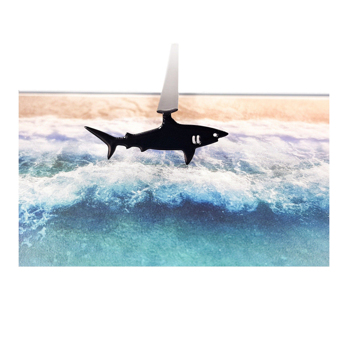 Shark metal bookmark on a coloured background