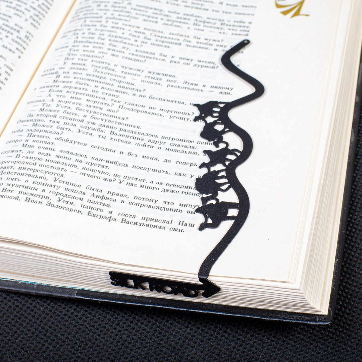 Silk Road metal bookmark on a coloured background