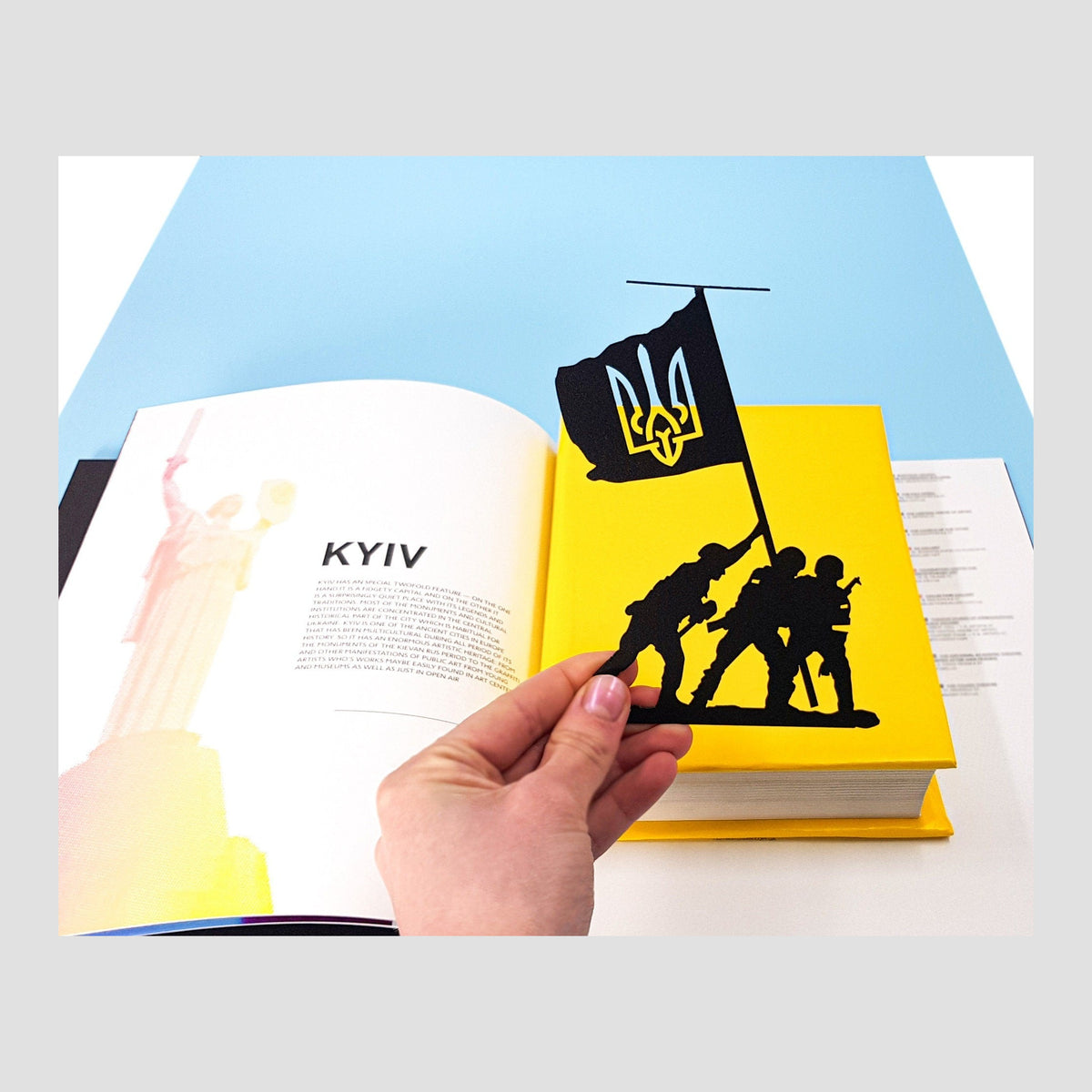 Slava Ukraini metal bookmark on a coloured background