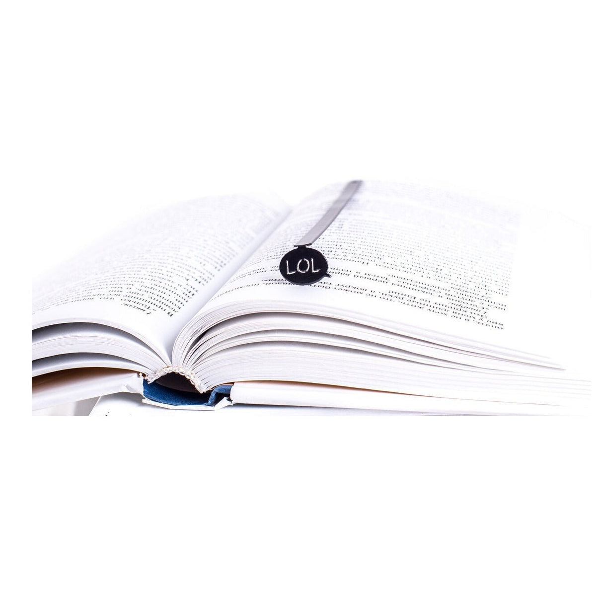 Speech Bubble LOL metal bookmark resting on the pages of an open book