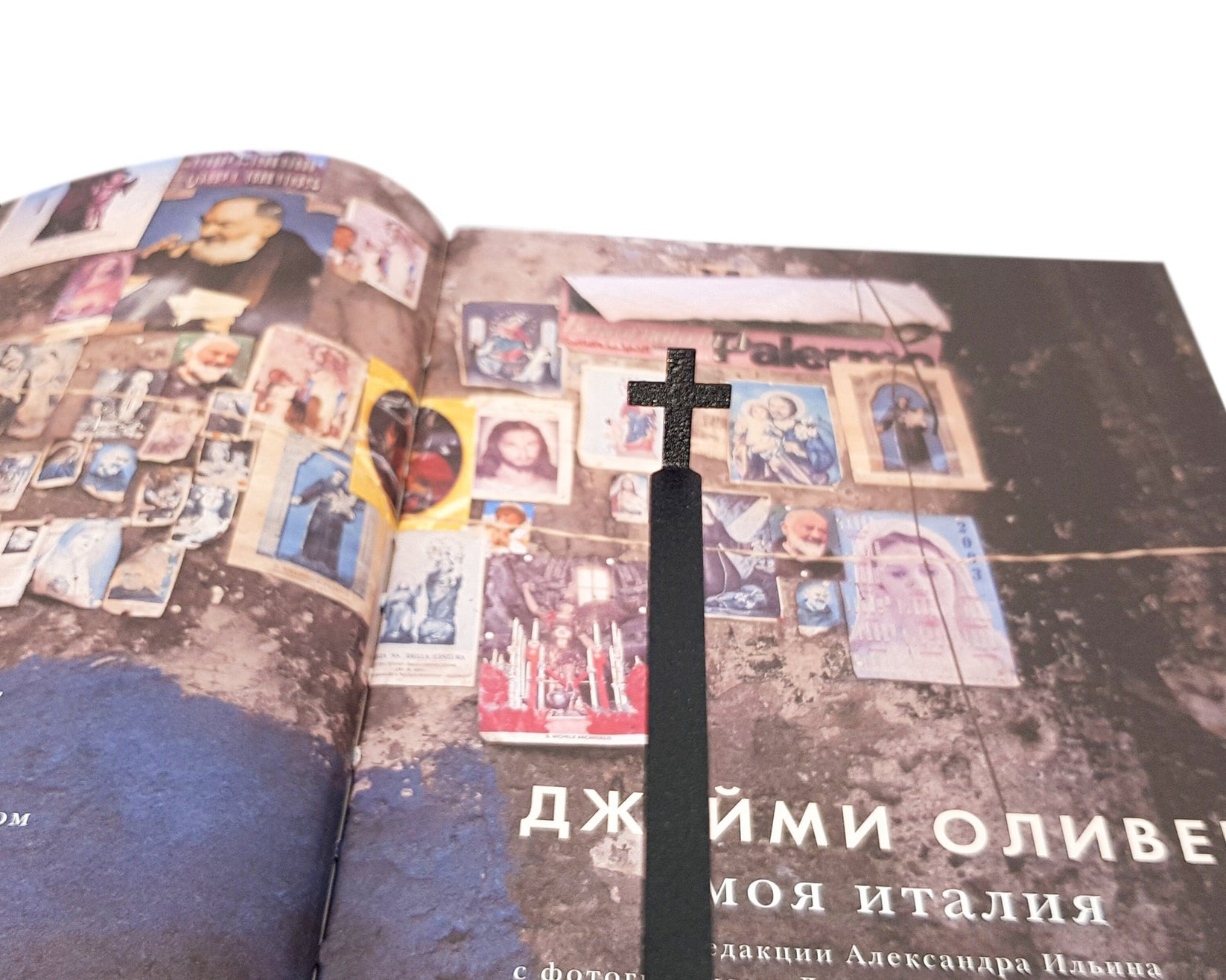 Straight Cross metal bookmark shot on a coloured surface