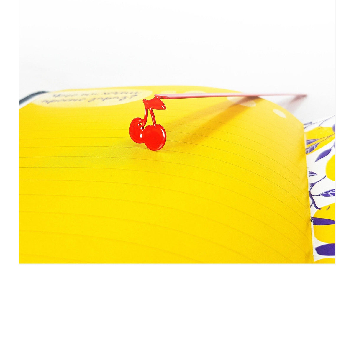 Sweet Cherries metal bookmark in red on a coloured background