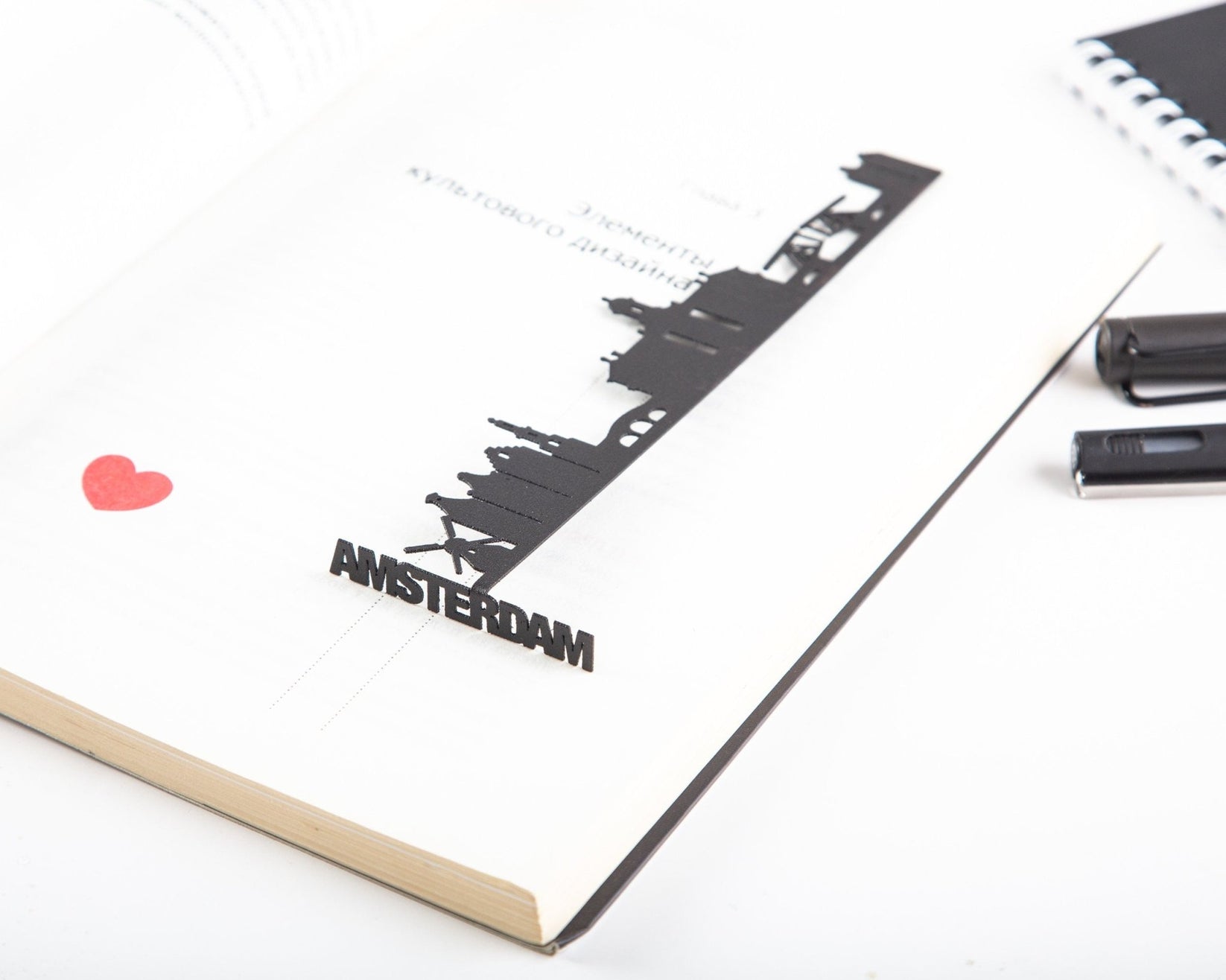 Trip Journal Amsterdam Cityscape metal bookmark marking a page in a notebook, view 4