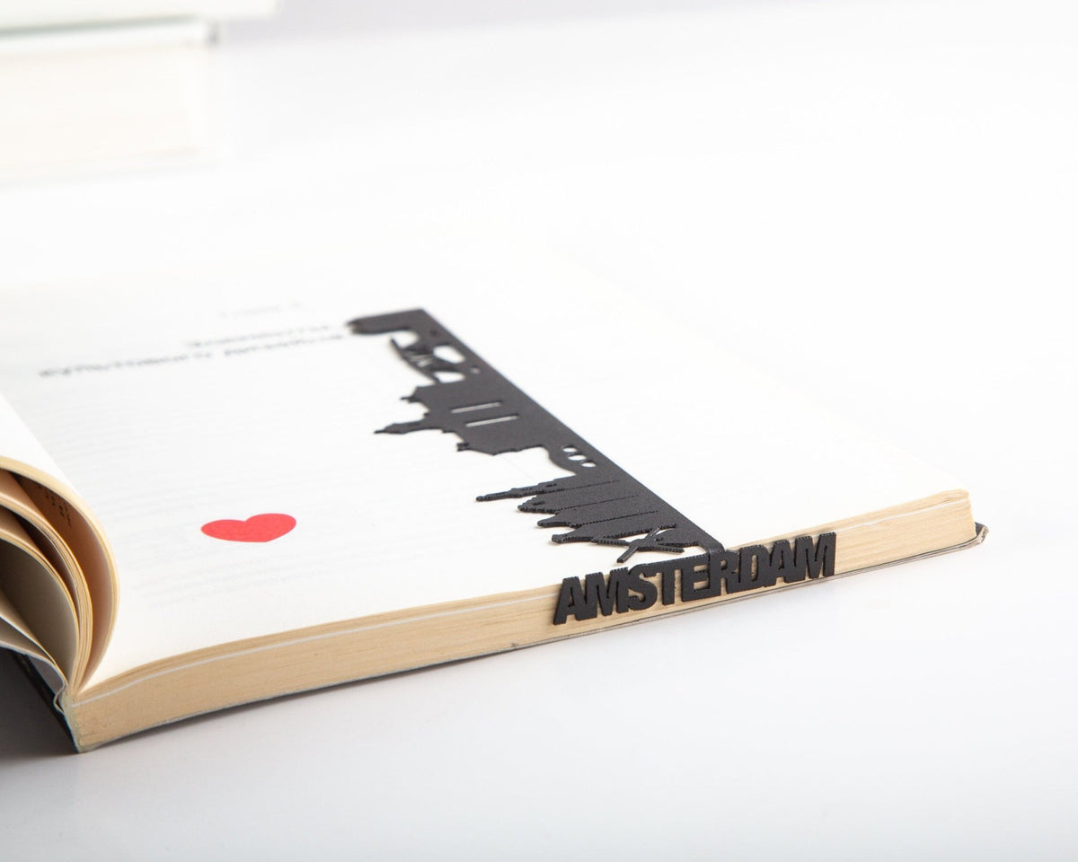 Trip Journal Amsterdam Cityscape metal bookmark holding a place in a journal