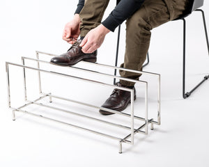 Stainless steel shoe rack with boots on the upper tier - Atelier Article
