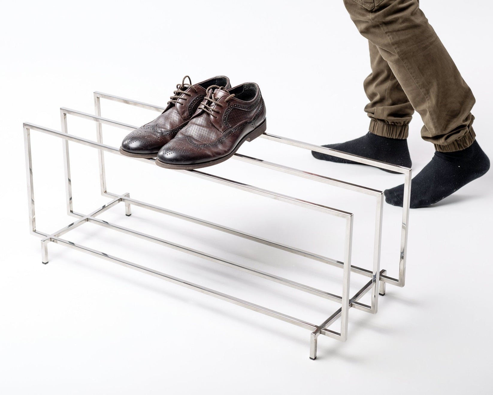 Hand-welded stainless steel frame detail of the two-tier shoe rack - Atelier Article