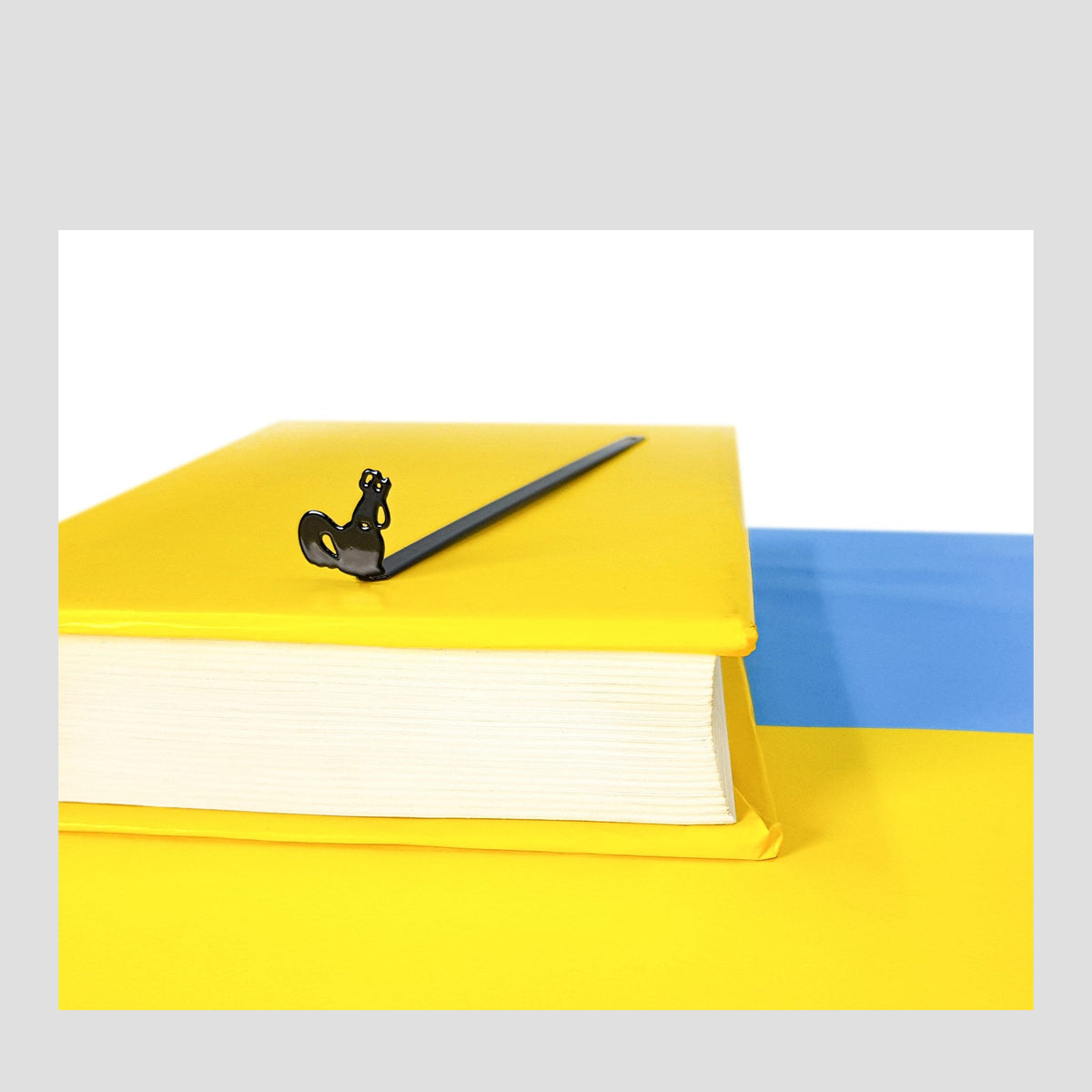 Ukranian Rooster from Borodyanka metal bookmark on a coloured background