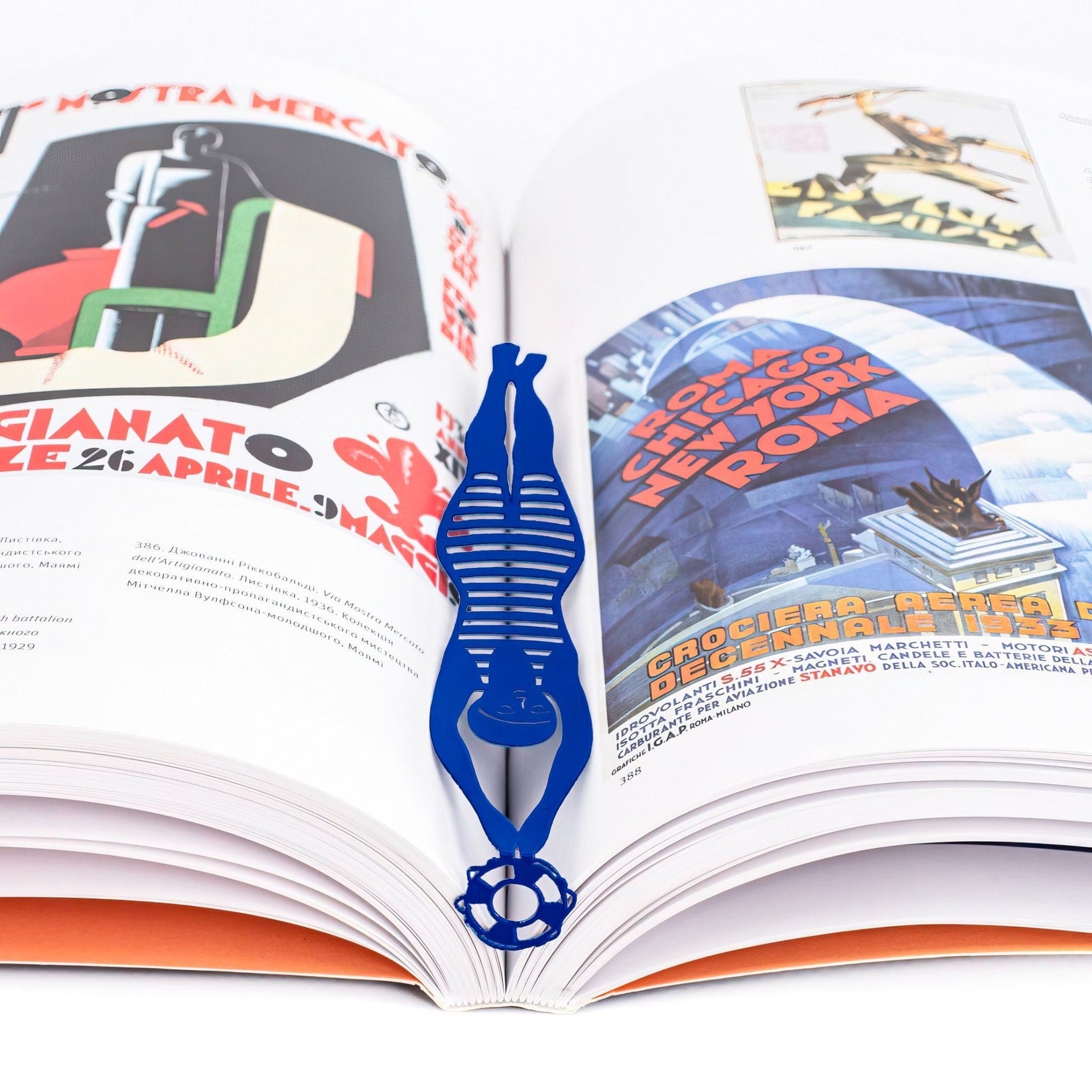 Diving Girl metal bookmark in blue placed on a colour illustration