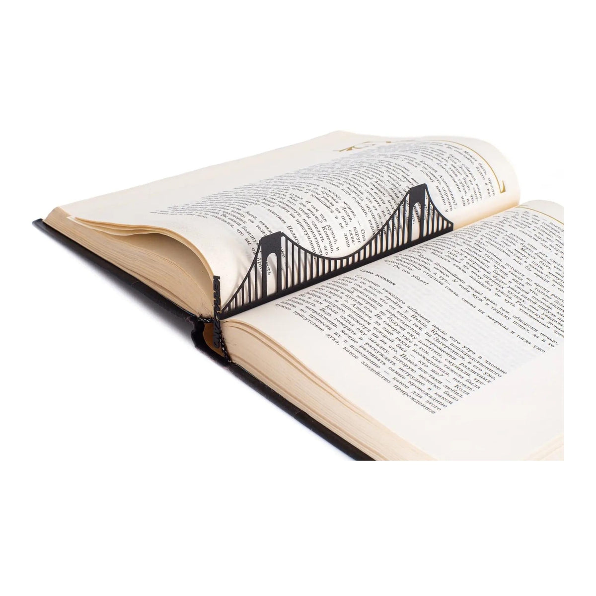 Verrazano Bridge metal bookmark resting on the pages of an open book