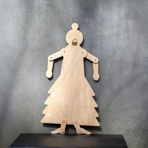 Back of wooden flamenco puppet showing natural plywood, brass wall hook and joint fasteners