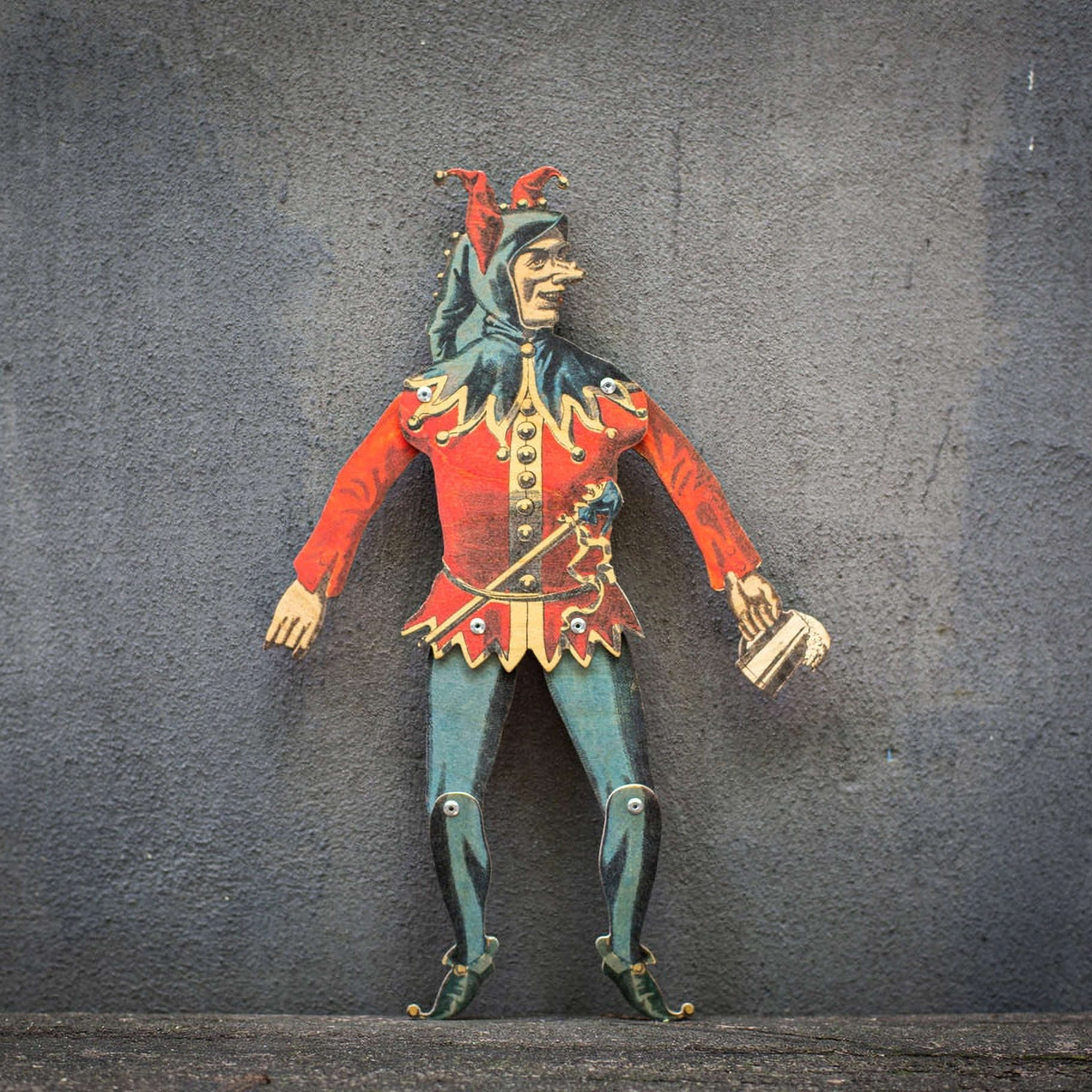 handmade articulated plywood jester puppet with movable joints front view