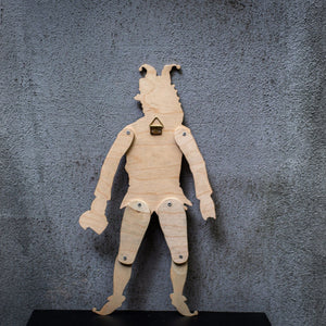 Back view of handmade articulated plywood jester puppet with wall hanging mount