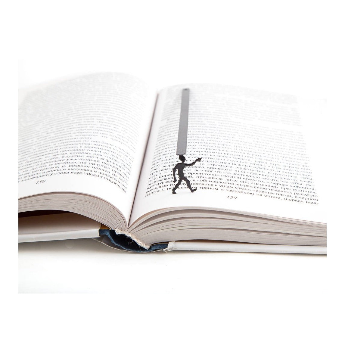 Zombies Are Coming metal bookmark resting on the pages of an open book